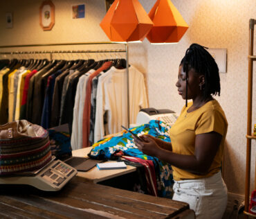 A Nigerian e-commerce store attendant arranging inventory